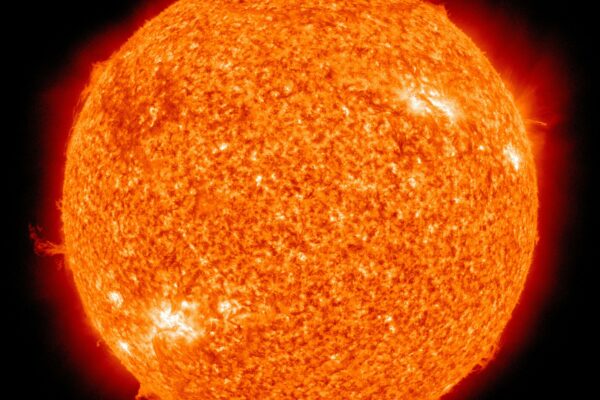 Detailed image of the sun showcasing its fiery surface and glowing edges.